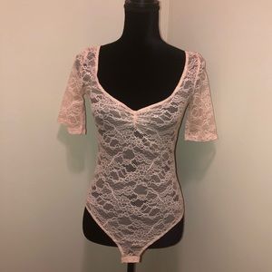 Brand New Zara Trafaluc Beige bodysuit tee.
